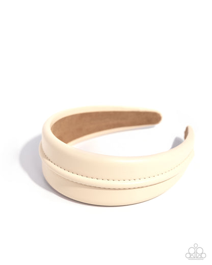 Beige headband on a white background