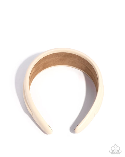Beige headband on a white background