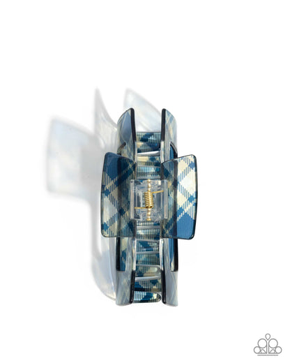 Decorative wall sconce with blue and white plaid design on a white background