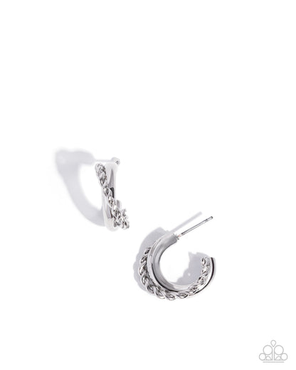 Silver hoop earrings on a white background