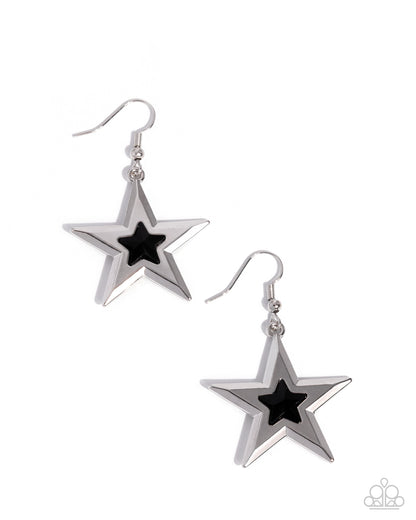 Star-shaped earrings with black centers on a white background