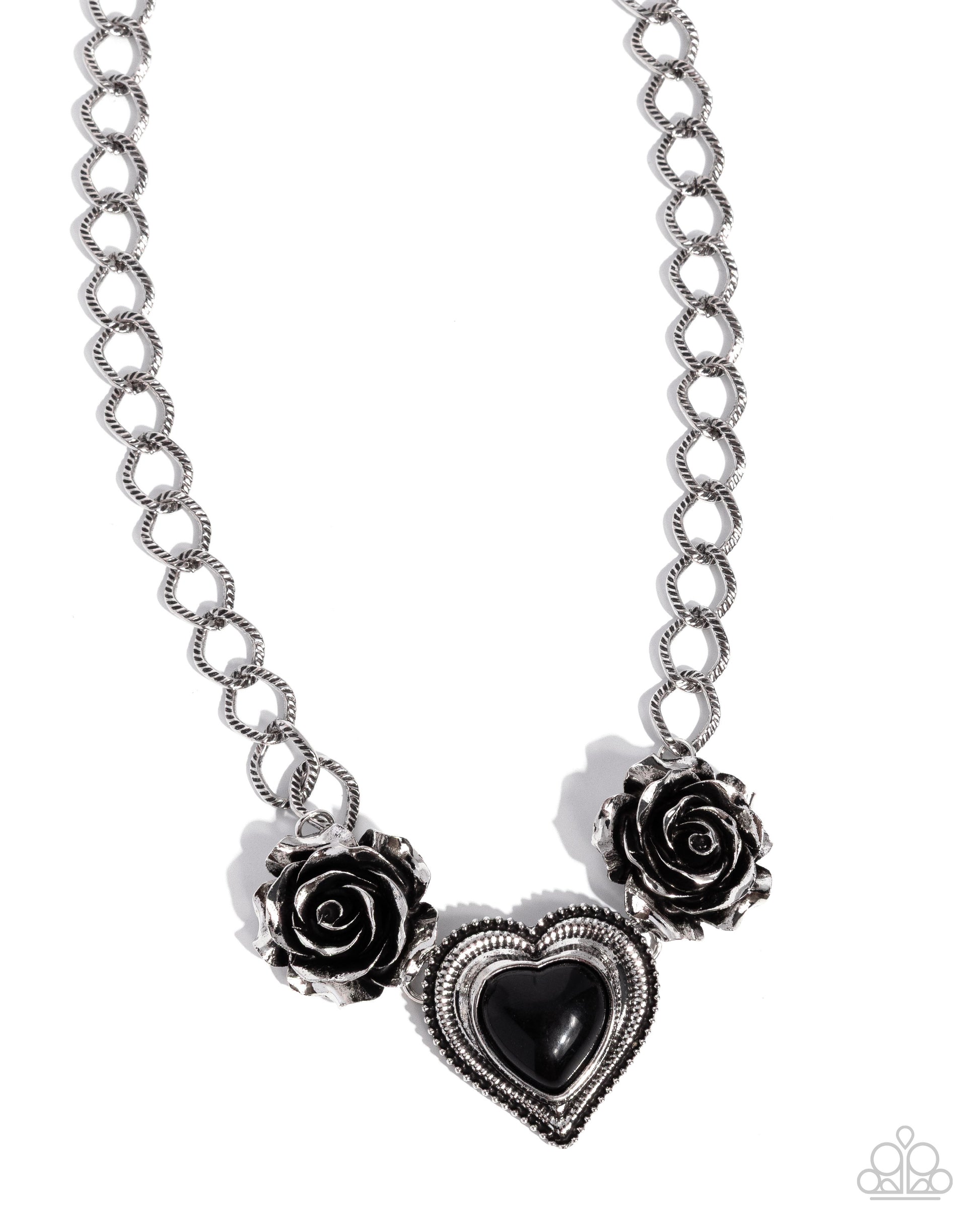 Necklace with black heart and rose charms on a white background