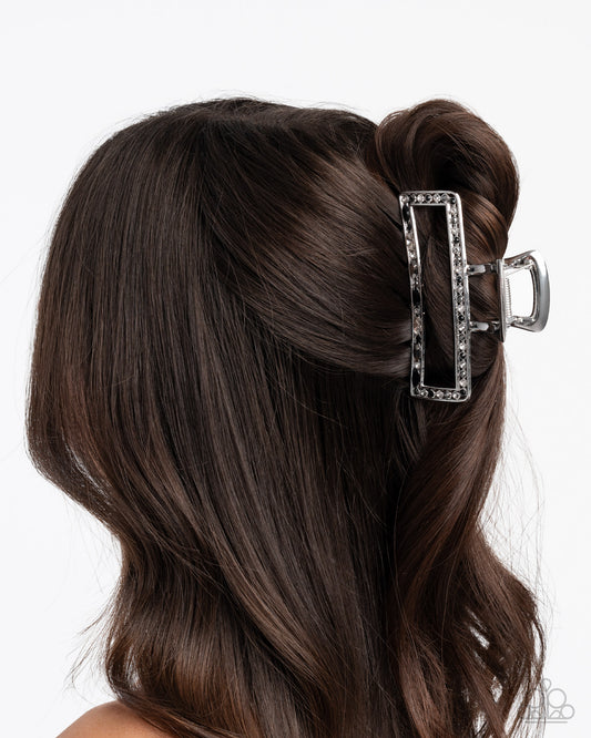 Hair clip in a styled hair on a white background