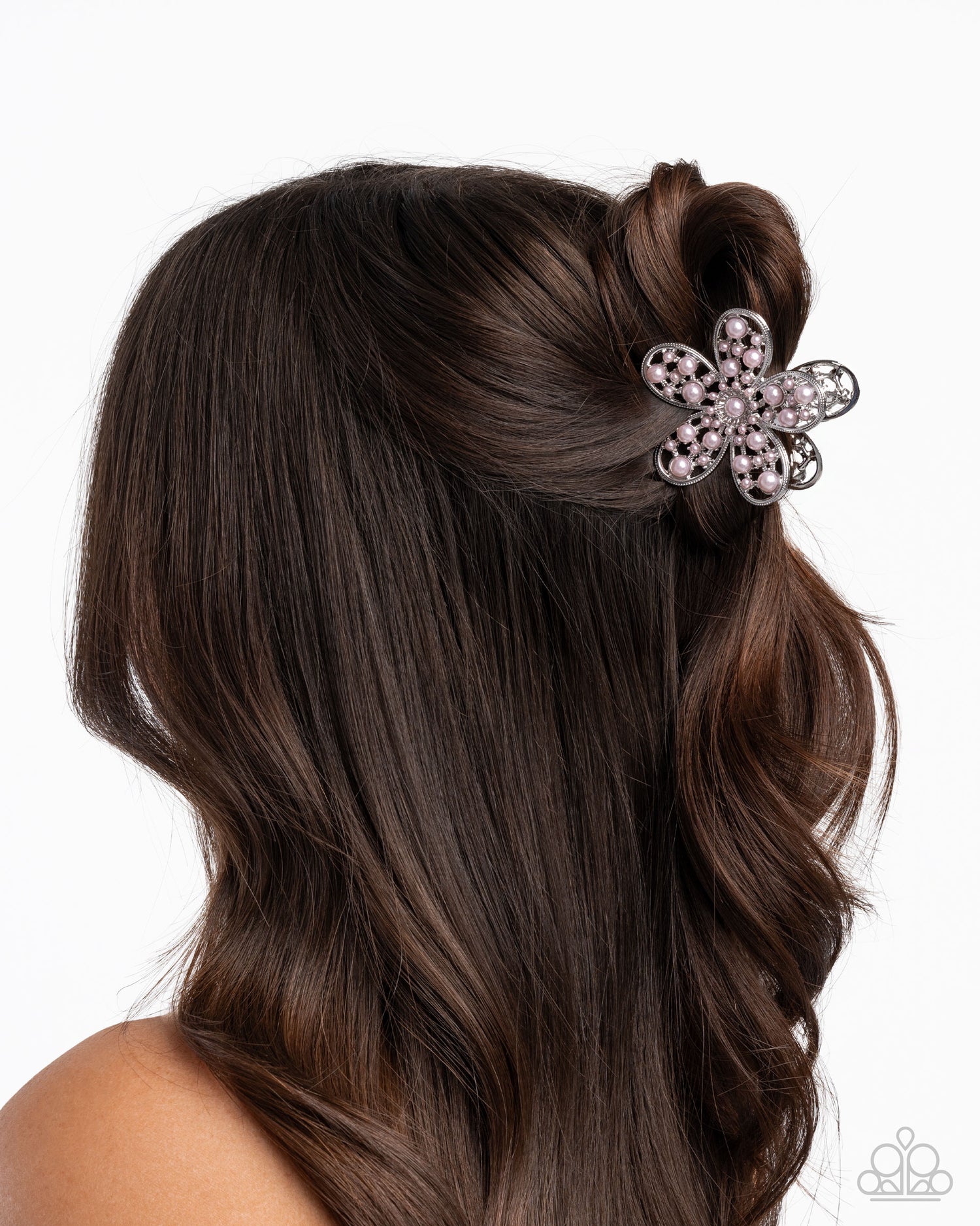 Hair with a decorative flower clip on a white background