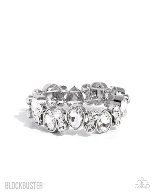Silver bracelet with clear gemstones on a white background