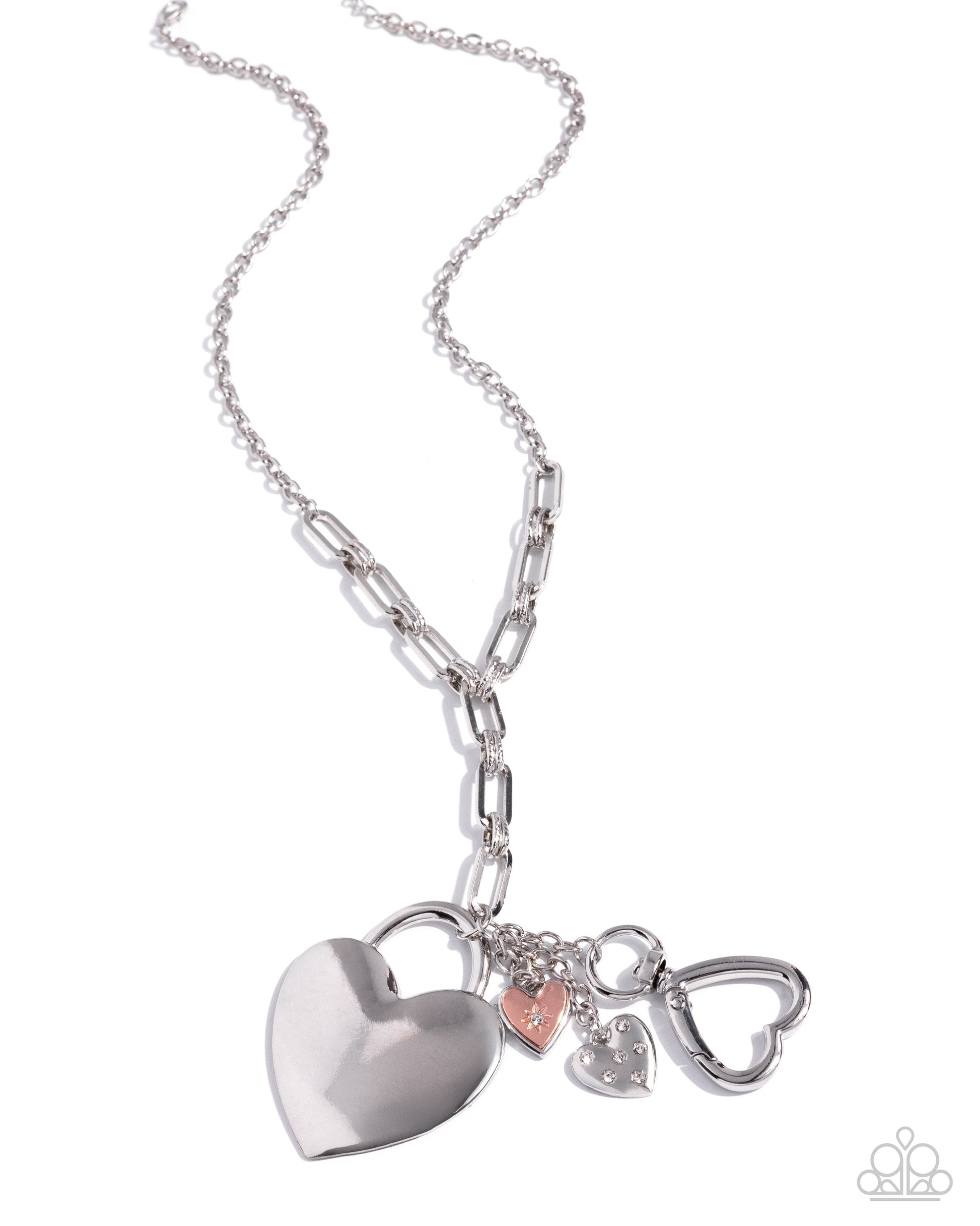 Silver necklace with heart-shaped charms on a white background