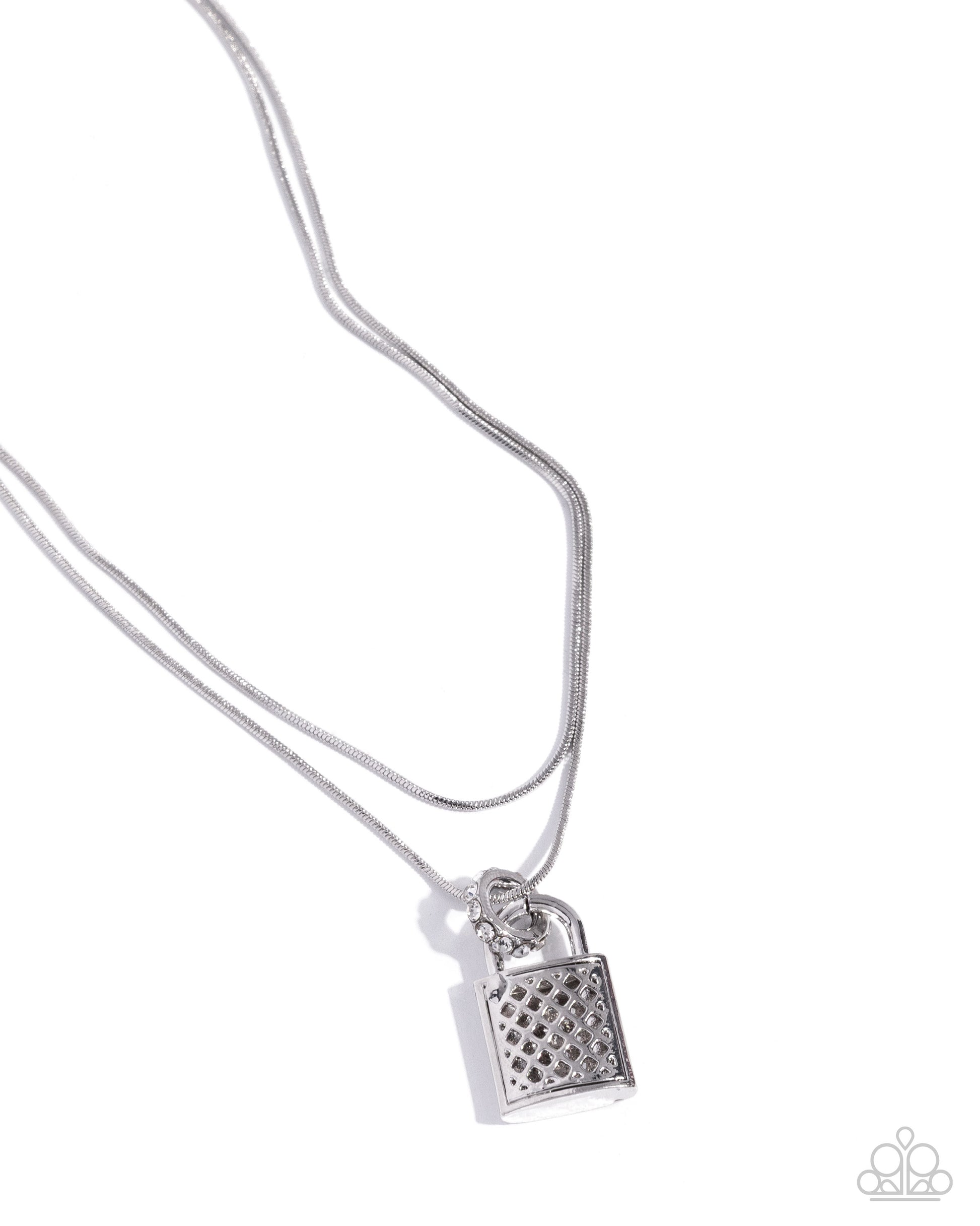 A silver necklace featuring a textured padlock pendant on a delicate chain, photographed against a clean white background with a Paparazzi logo watermark in the bottom right corner.