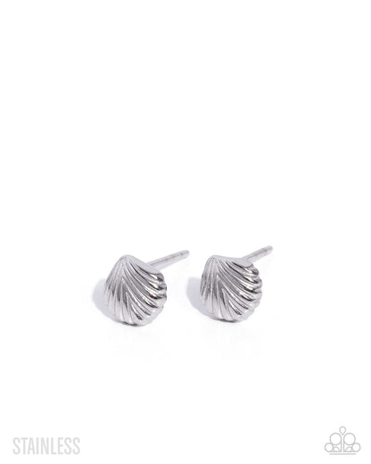 Pair of silver shell-shaped earrings on a white background