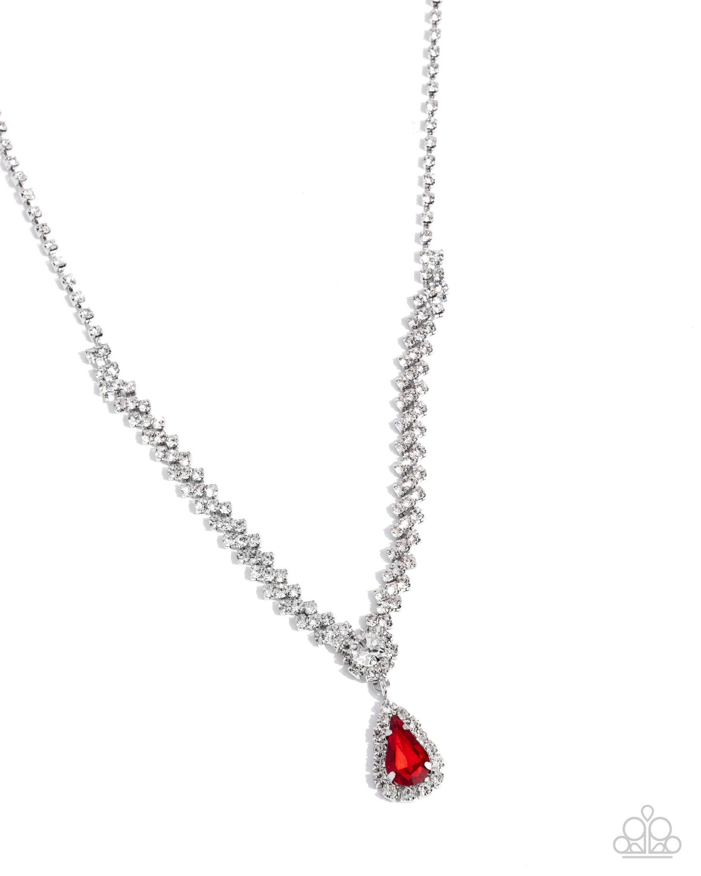 A silver-toned beaded necklace with a teardrop-shaped pendant featuring a bright red gemstone surrounded by small clear stones, shown on a plain white background.