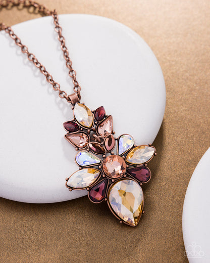 Necklace with multicolored gemstones on a white stone surface