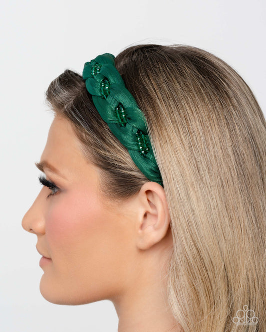 Woman wearing a green headband with decorative elements on a white background