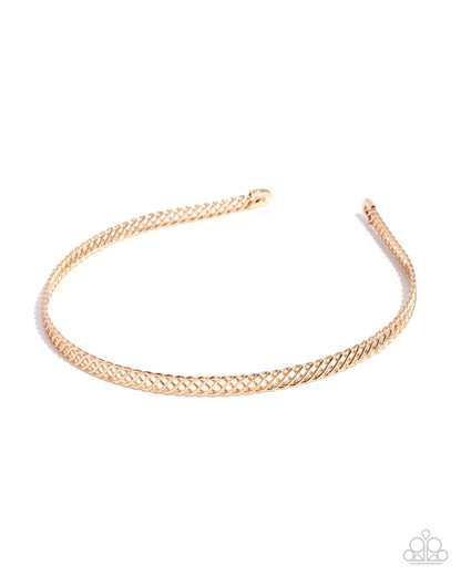Rose gold headband on a white background