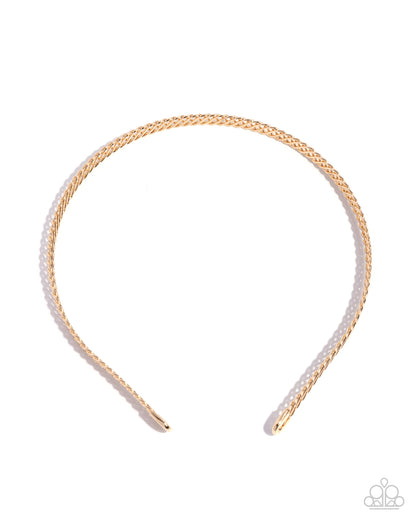 Gold headband with white beads on a white background