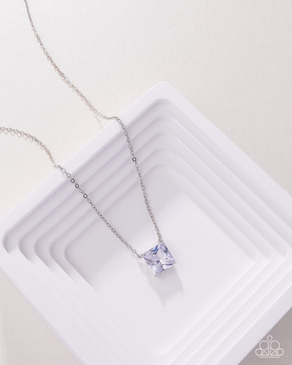 Silver necklace with a purple gemstone on a white background