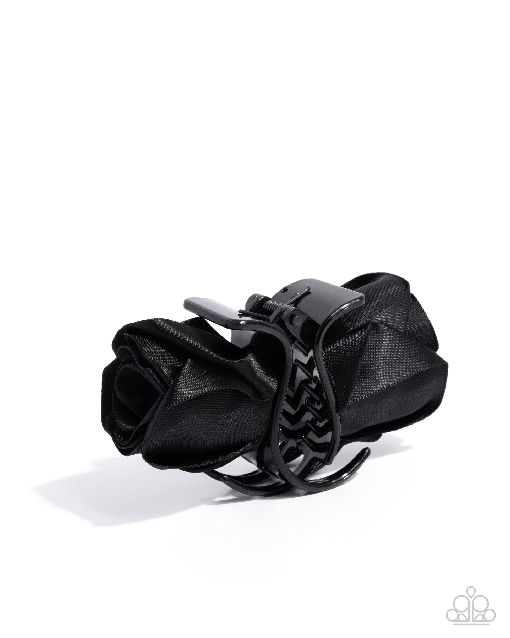 Black hair clip with floral design on a white background