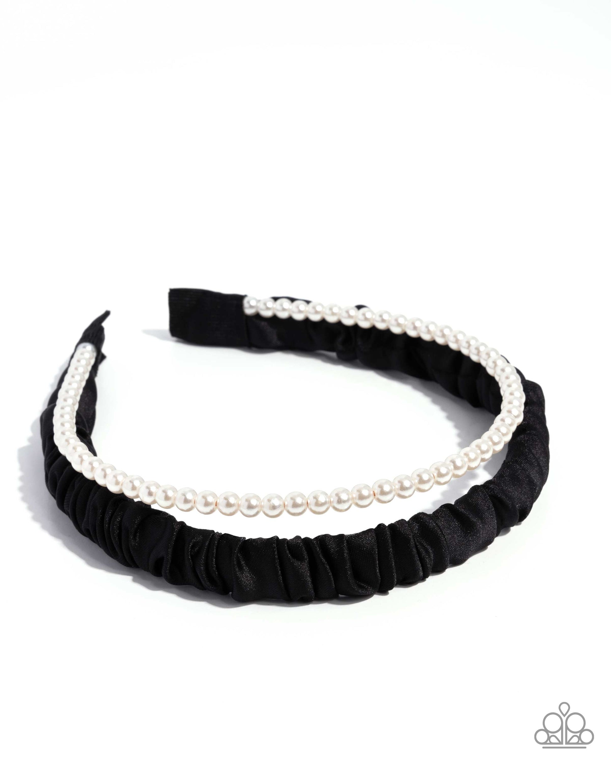Black headband with white pearls on a white background