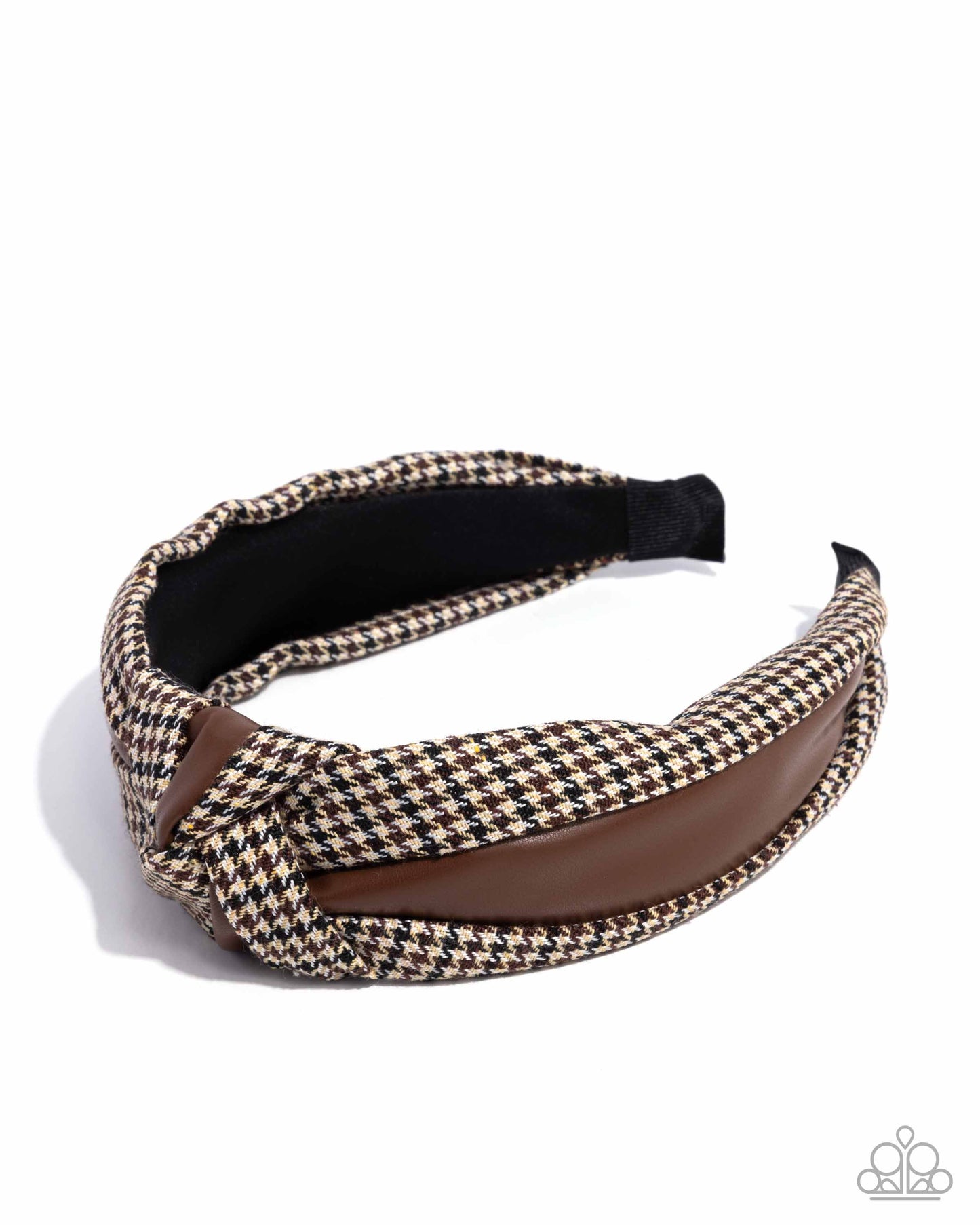 Houndstooth patterned headband with brown accent on a white background