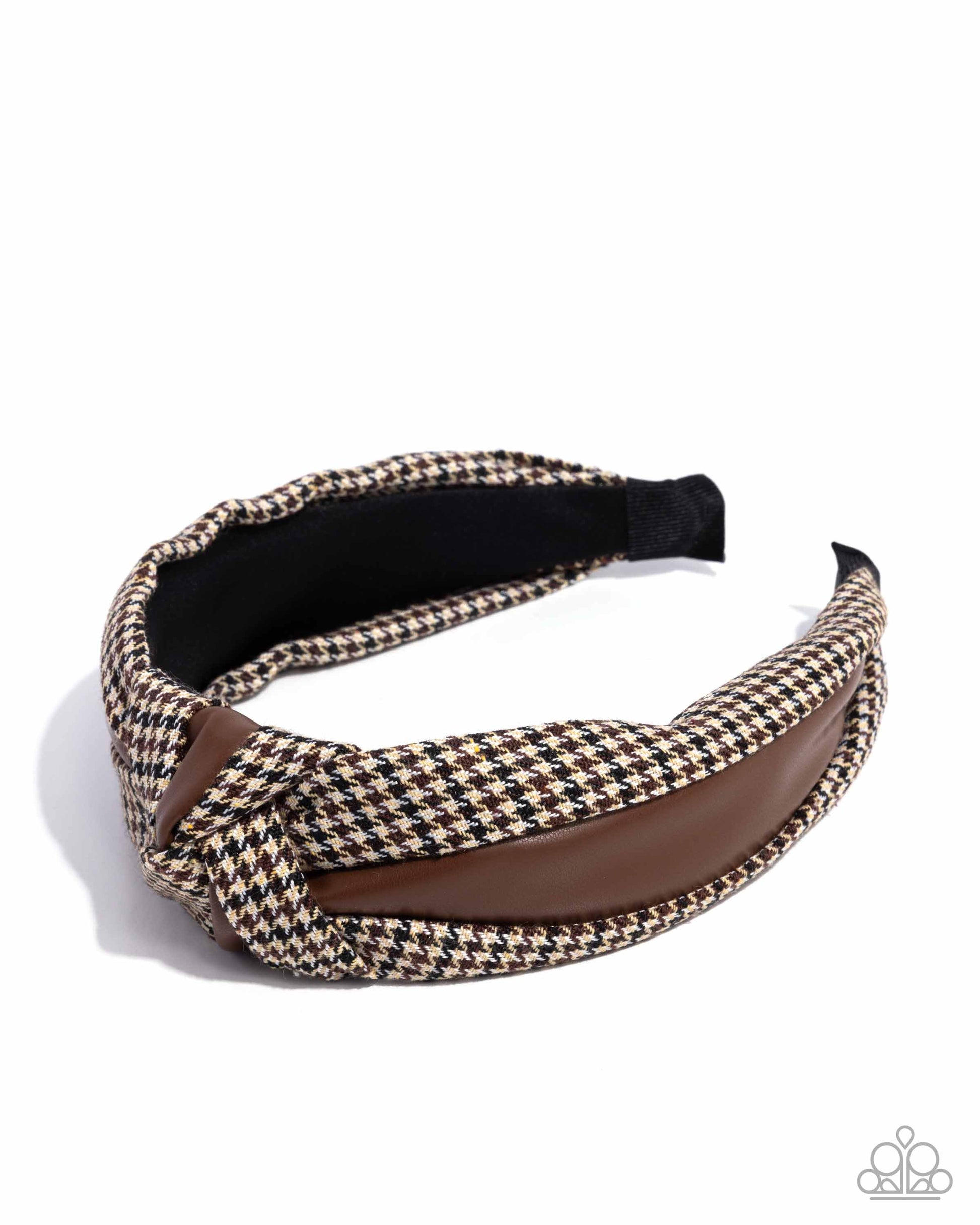 Houndstooth patterned headband with brown accent on a white background