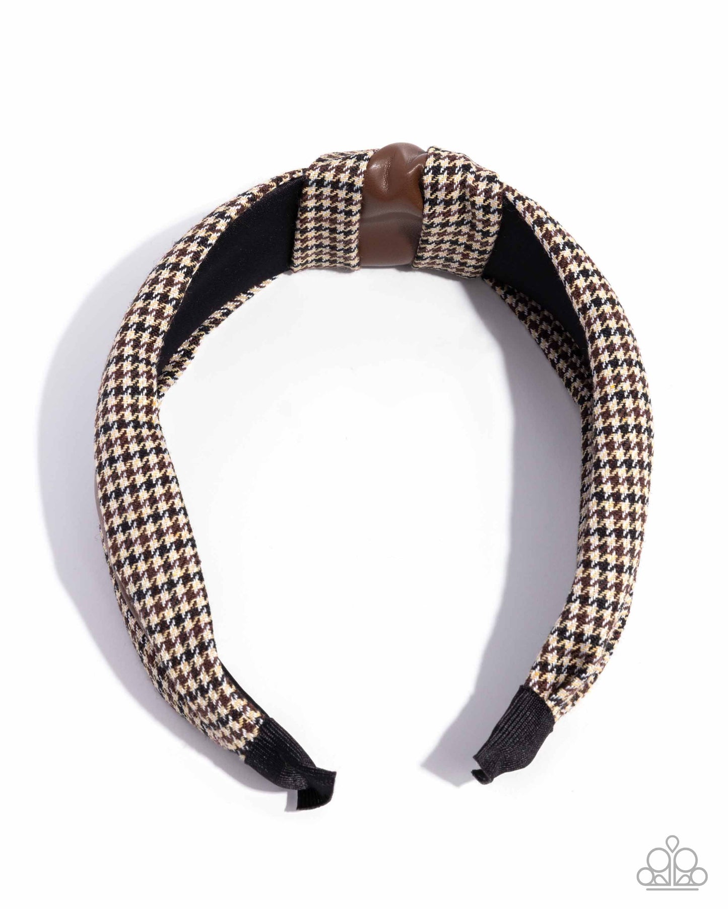 Houndstooth patterned headband with brown and black accents on a white background