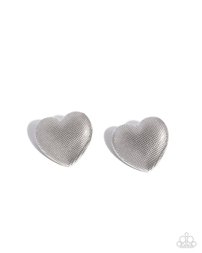 Heart-shaped silver mesh earrings on a white background