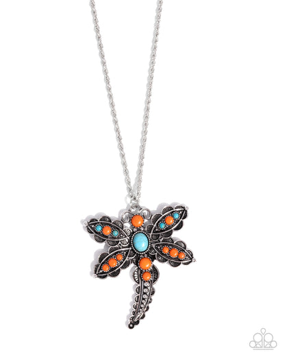 Dragonfly-shaped necklace with colorful stones on a white background