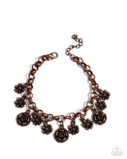 Copper necklace with floral charms on a white background