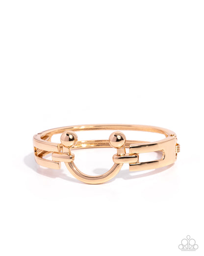 Gold bracelet on a white background
