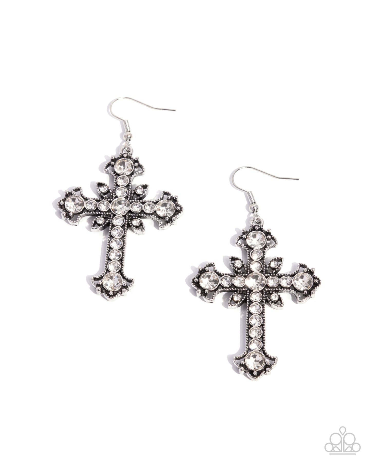Pair of cross-shaped earrings with rhinestone detailing on a white background