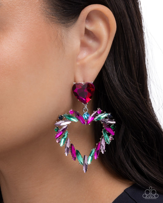 Multicolored heart-shaped earring worn by a model