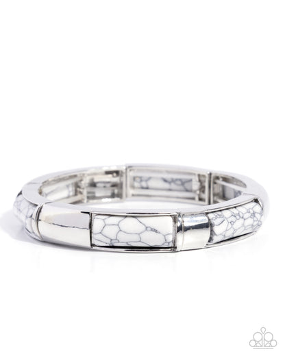 Silver bracelet with a white marbled pattern on a white background