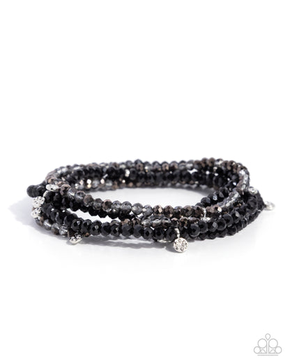 Black beaded bracelet on a white background