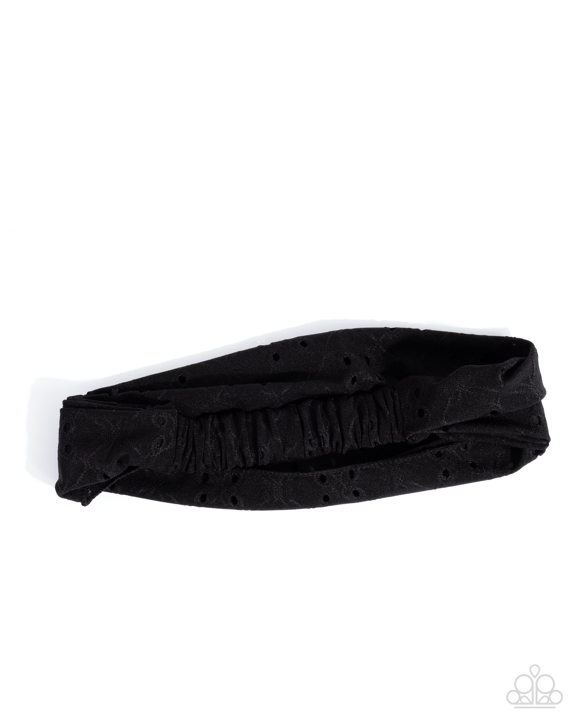 Black headband with small holes on a white background