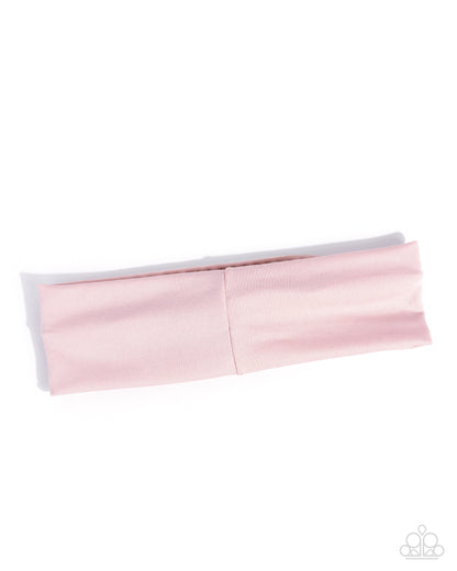 Pink and gray headband on a white background