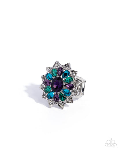 Jewelry ring with multicolored gemstones on a white background