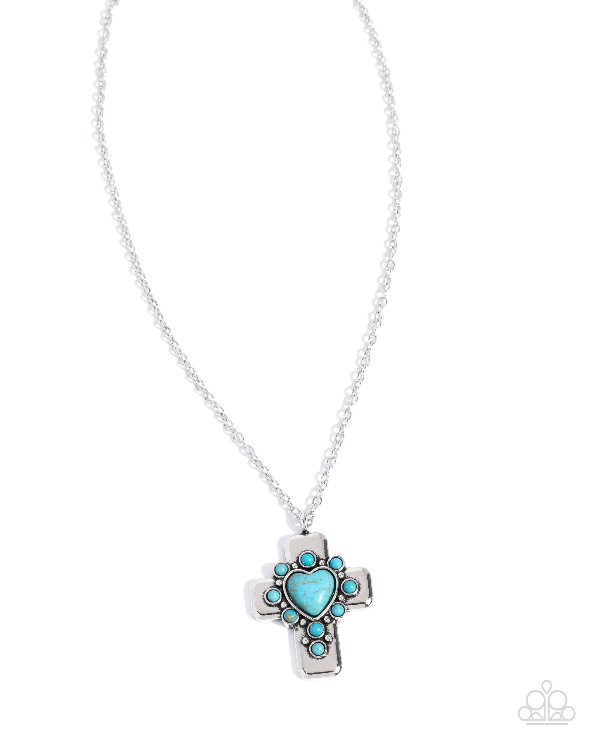 Silver cross necklace with turquoise stones on a white background