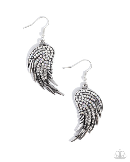 Silver wing-shaped earrings with gemstones on a white background