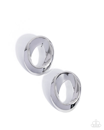 Two silver hoop earrings on a white background