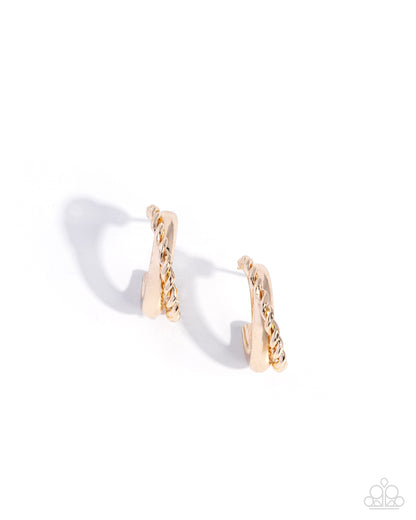 Gold hoop earrings on a white background