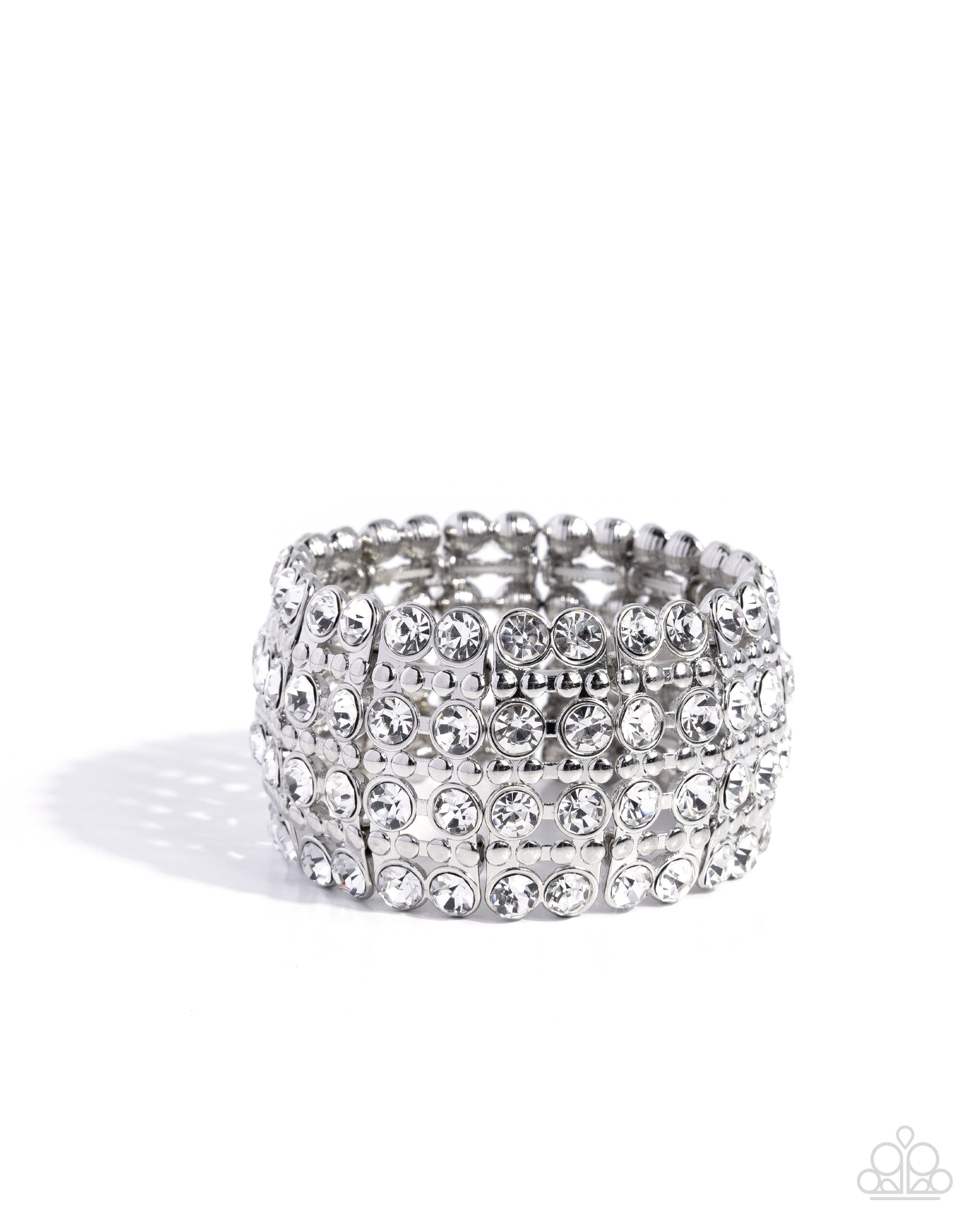 Silver ring with multiple rows of rhinestones on a white background