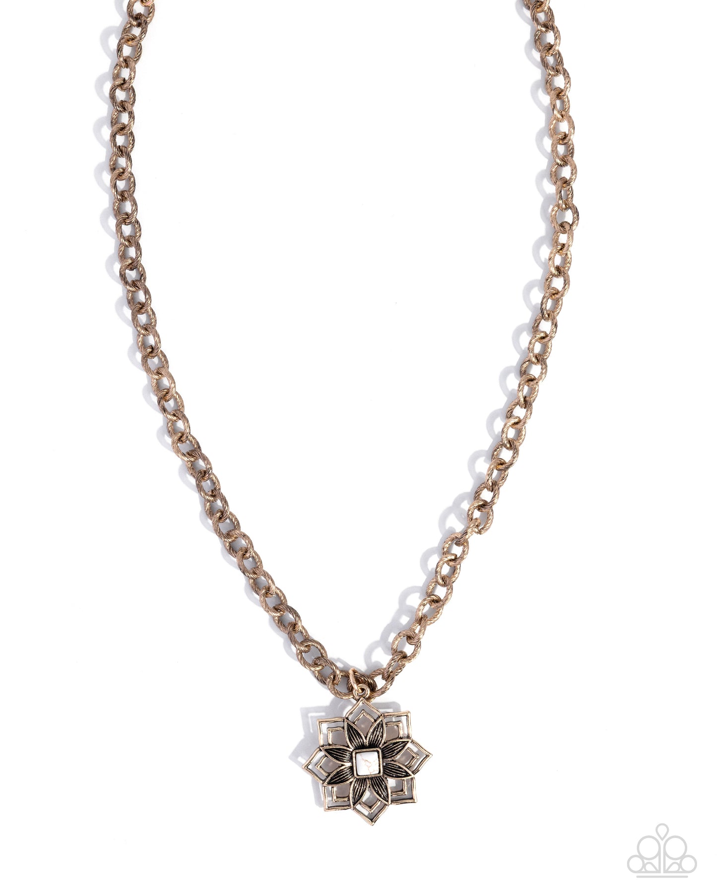 A gold-toned chain necklace with a geometric, flower-like pendant featuring clear rhinestones, shown against a plain white background.