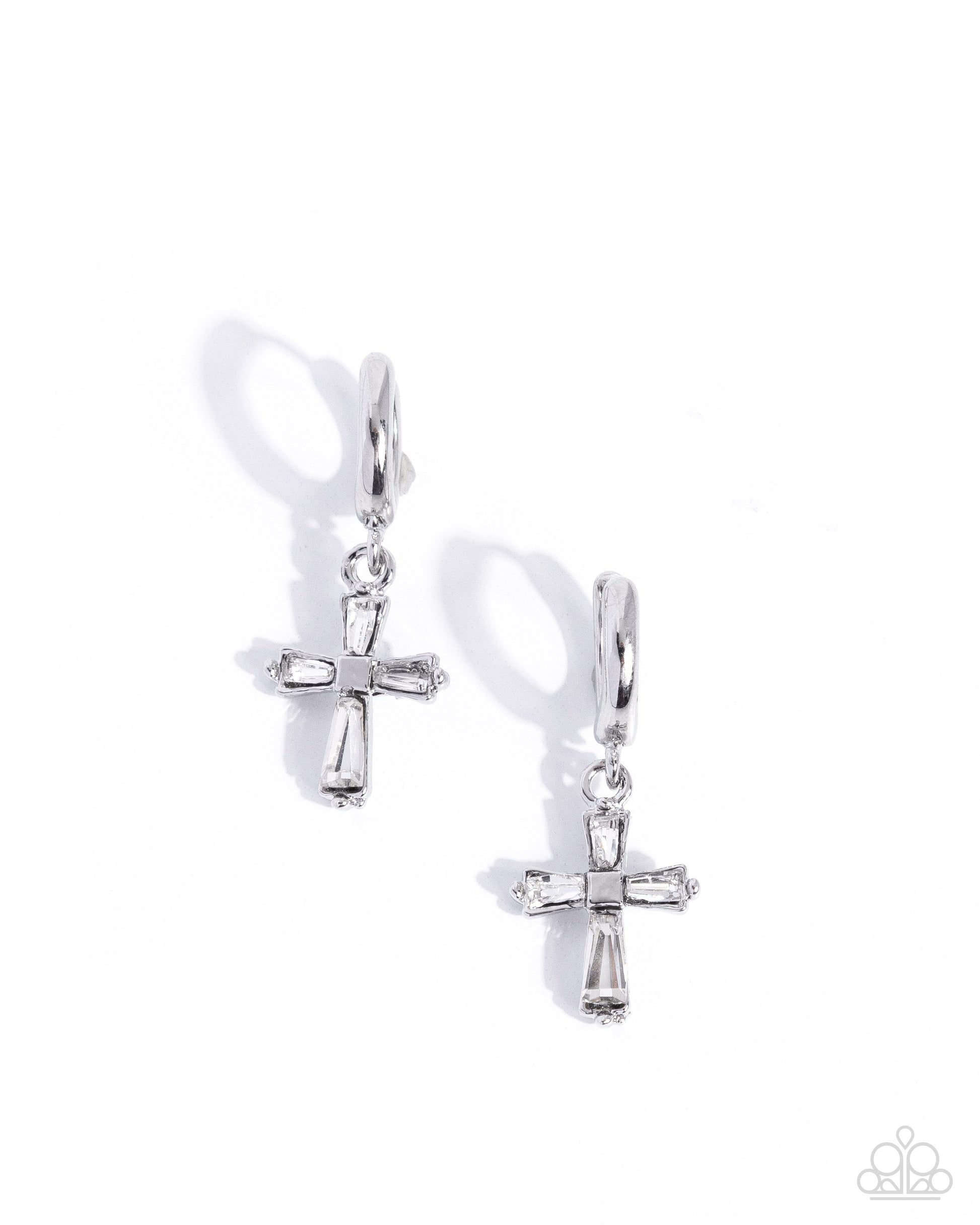 Pair of silver cross earrings on a white background
