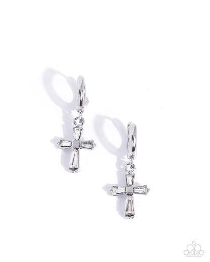Pair of silver cross earrings on a white background