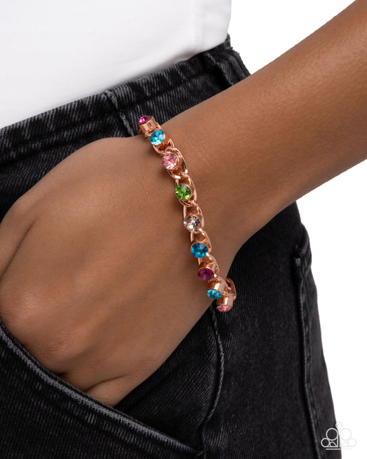 Multicolored beaded bracelet on a wrist with a white background