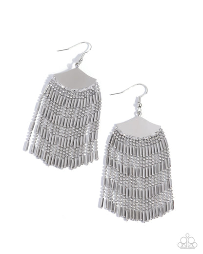 Pair of silver fringe earrings on a white background