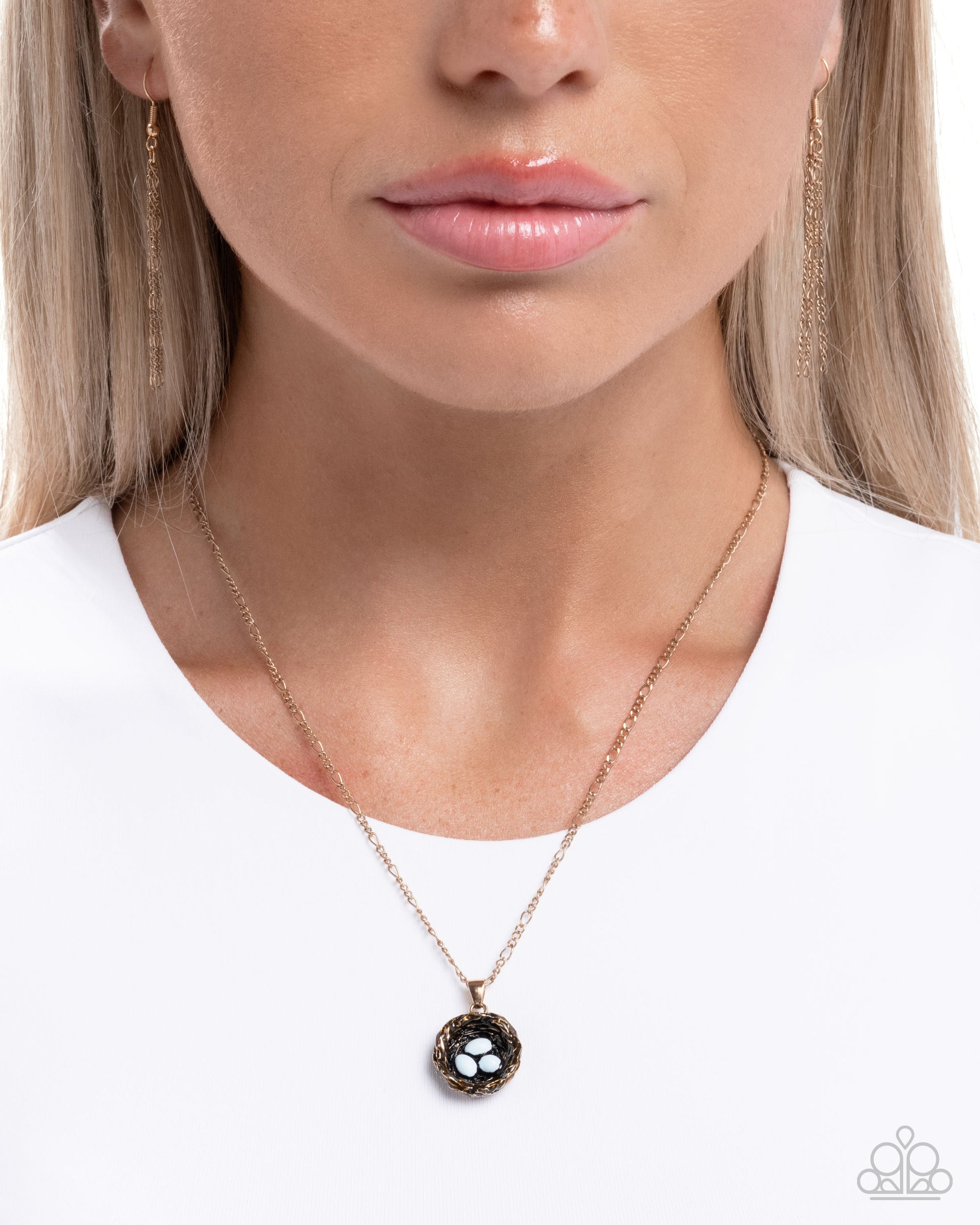 Necklace worn by a model on a white background