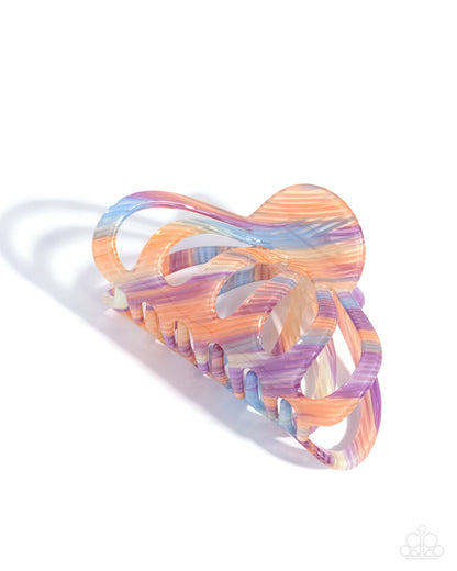 Multicolored hair clip on a white background