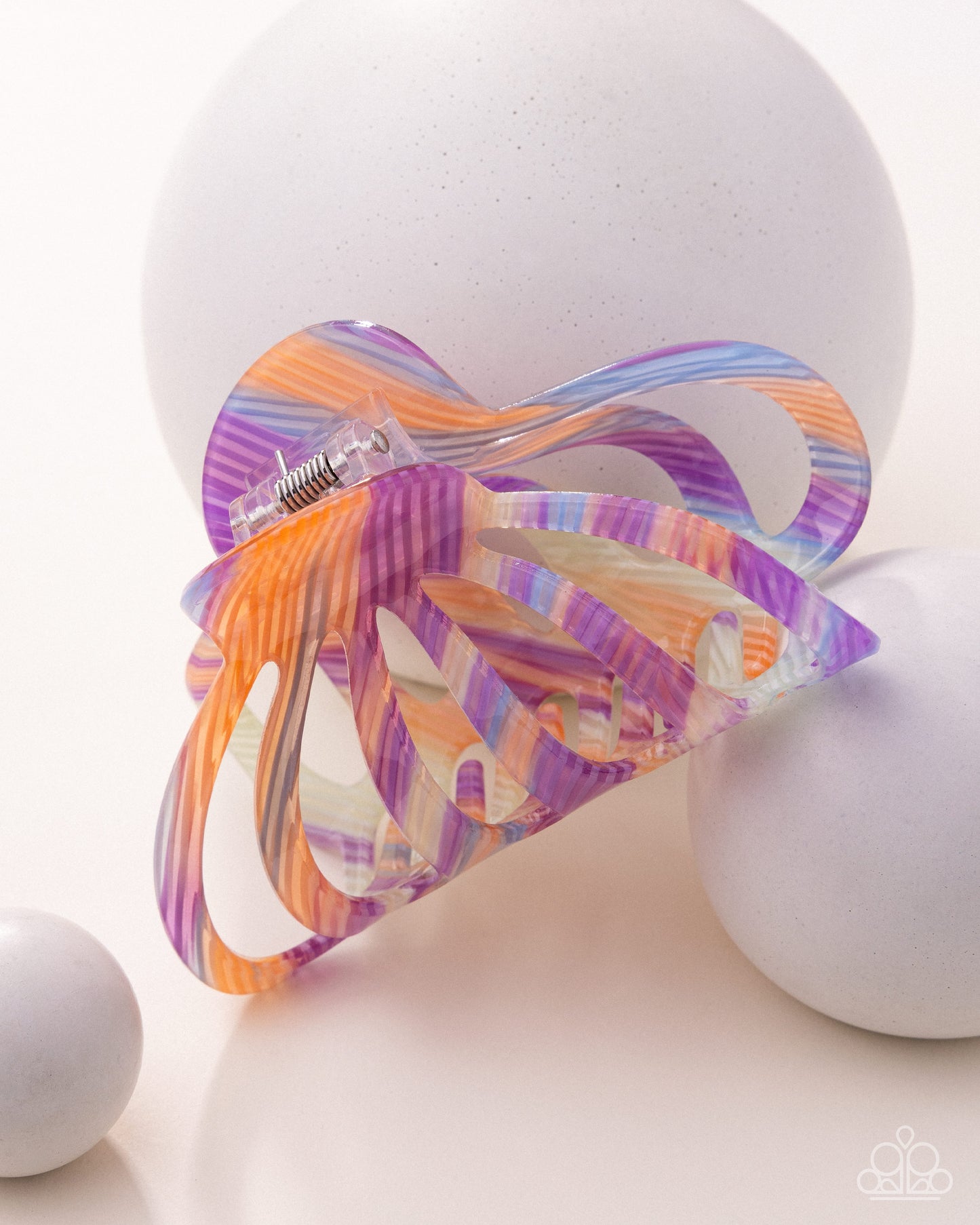 Colorful butterfly-shaped clip on a white background