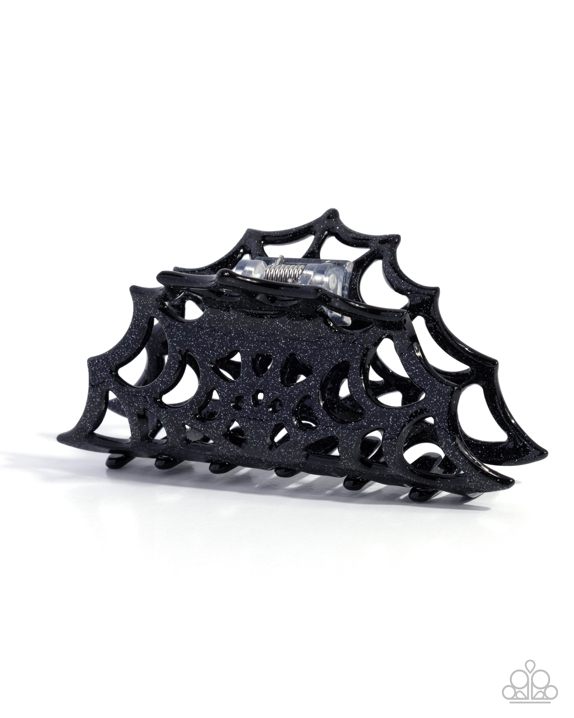 Black spiderweb-shaped hair clip on a white background