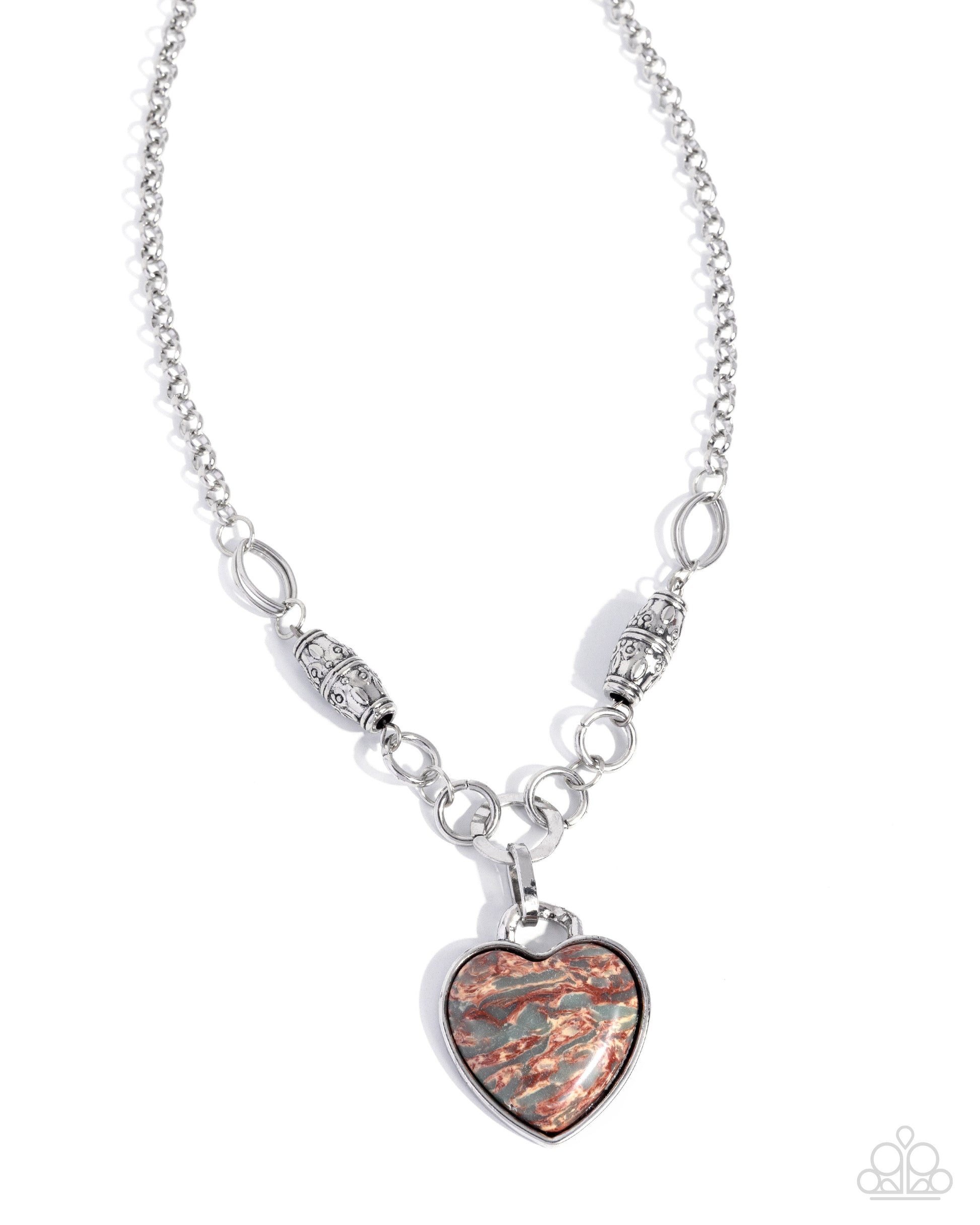 Silver necklace with a heart-shaped pendant on a white background