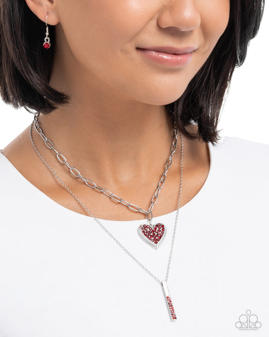 Close-up of a woman wearing multiple necklaces with heart and bar pendants on a white background